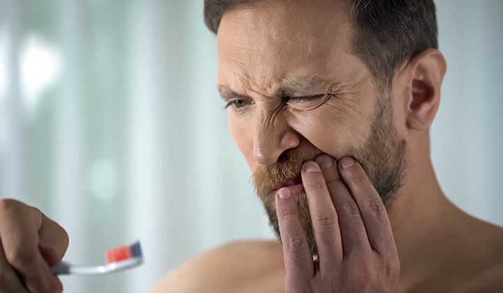 Man with bleeding gums Man with bleeding gums