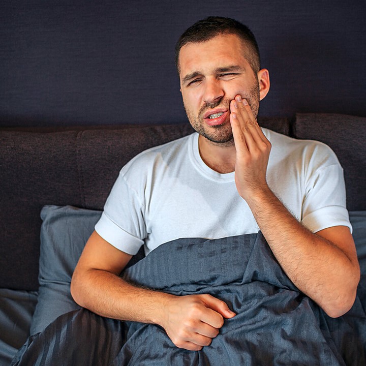 Man touches his mouth Discomfort of the oral cavity due to poor oral hygiene