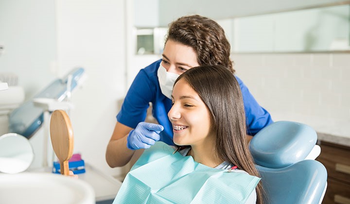 Girl with braces at the dentist Girl with braces at the dentist